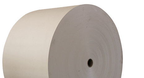A roll of white containerboard.