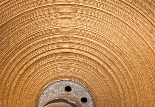 An abstract view of a containerboard roll