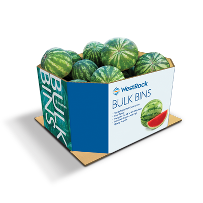 A blue and white large bulk bin container holding watermelons.