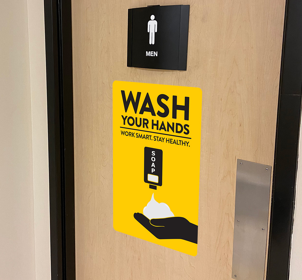 Health and hygiene wash your hands signage on door