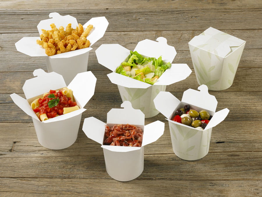 A group of SmartServ folding carton containers holding food.