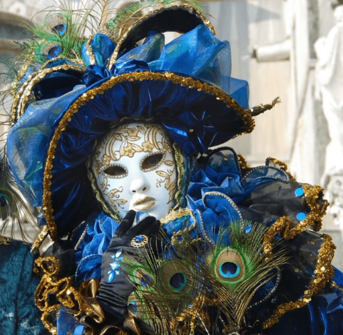 Person wearing a mask with blue outfit