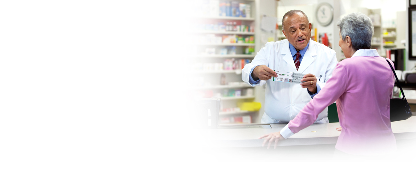 Elderly woman talking to pharmacist